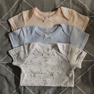 Set of Three Baby Onesies in Pastel Colors